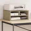 A white printer sits on top of a wooden printer stand on a desk. Anteprima dell’immagine prodotto