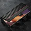 A black carbon fiber and leather wallet case for a Samsung Galaxy Note20 5G/4G is shown open, displaying the phone screen and a red accent stripe on the case. Produktbild-Vorschau