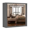 A mirrored wardrobe reflecting a bedroom interior. Voir les images du produit