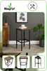 A bar stool is shown in a room setting with a cabinet and plants. Podgląd zdjęcia produktu