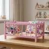 Ein hölzernes Puppenbett in Rosa mit Bettwäsche im Produktbild-Vorschau 7