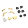 A collection of replacement parts for a game controller, including joysticks, paddles, and buttons, laid out on a white background. Produktbild-Vorschau