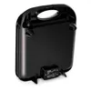 The underside of a black sandwich maker is shown, with its power cord and product information label visible. Náhľad obrázku produktu