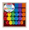 A wooden box filled with colorful lacing beads and red laces. Podgląd zdjęcia produktu
