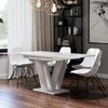 A dining table and chairs in a modern dining room setting. Produktbild-Vorschau