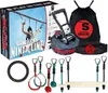 A product shot of a Slackers Ninja Line starter set, including the box, slackline, ratchet, storage bag, and various accessories. Produktbild-Vorschau