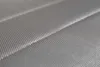 A close-up, angled view of a textured, gray surface with parallel ridges. Produktbild-Vorschau