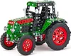 A detailed model of a green and red tractor made from construction toy parts, shown against a white background. Produktbild-Vorschau