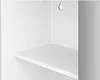 A close-up view of a white shelf inside a cabinet. Náhled obrázku produktu
