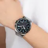A man's wrist wearing a silver and black Festina chronograph watch. Náhľad obrázku produktu