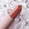 A close-up shot of a lipstick with a textured surface, set against a background of sparkling crystals. Produktbild-Vorschau