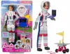 A Barbie astronaut doll and accessories are displayed in their packaging, with a separate doll shown outside the packaging. Produktbild-Vorschau