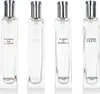 Four clear glass perfume bottles with silver caps, arranged side-by-side against a white background. Voir les images du produit