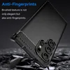 A black phone case with a carbon fiber texture detail is shown at an angle, with debris falling around it. Produktbild-Vorschau