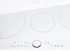 A close-up, top-down view of a white induction cooktop with three heating zones and touch controls. Náhľad obrázku produktu