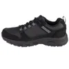 A side view of a black Skechers sneaker against a white background. Anteprima dell’immagine prodotto
