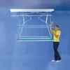 A woman is standing next to a ceiling-mounted clothes drying rack. Anteprima dell’immagine prodotto