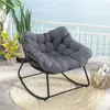 A rocking chair on a balcony overlooking the ocean. Anteprima dell’immagine prodotto