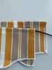 A close-up view of a striped awning fabric with a black cord running through it. Produktbild-Vorschau