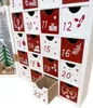 A close-up view of a wooden advent calendar with numbered drawers, some of which are open. Produktbild-Vorschau