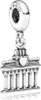 A silver charm depicting the Brandenburg Gate in Berlin, with the word "BERLIN" inscribed on the top part of the charm. Produktbild-Vorschau