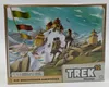 The image shows the box art for the board game "Trek 12 Himalaya", depicting two hikers ascending a snowy mountain towards a temple complex. Produktbild-Vorschau