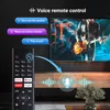 A remote control is shown in the foreground, with a television screen displaying a concert in the background. Voice commands are illustrated with speech bubbles and sound wave graphics. Produktbild-Vorschau