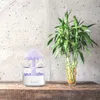 A humidifier shaped like a mushroom is placed on a wooden shelf next to a vase of lucky bamboo. Voir les images du produit