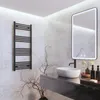 A modern bathroom with a black towel warmer mounted on a marble tiled wall. Podgląd zdjęcia produktu
