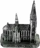 A silver miniature model of a cathedral, likely a souvenir, is displayed against a white background.