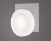 A white, round night light plugged into a wall socket. Voir les images du produit