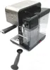 A black and silver Breville espresso machine is shown on a white background, with a coffee scoop in the foreground. Produktbild-Vorschau