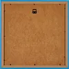 The back of a framed picture with a blue border and a brown MDF backing board. A black hanging hook is visible at the top center. Produktbild-Vorschau