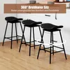 Three black bar stools are arranged in a kitchen setting. Podgląd zdjęcia produktu