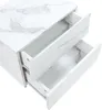 A close-up, angled view of a white nightstand with a marble pattern, showing two open drawers. Anteprima dell’immagine prodotto