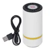 A white cylindrical vacuum sealer with a black top and a yellow band around the middle, shown with a black USB cable. The top has a circular vent with a red power button icon. Produktbild-Vorschau