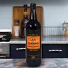 A bottle of Lea & Perrins Worcestershire Sauce is displayed on a marble countertop in a kitchen setting. Podgląd zdjęcia produktu