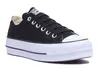 A studio shot of a black Converse platform sneaker. Voir les images du produit