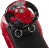 Close-up view of a red toy car's steering wheel and dashboard. Produktbild-Vorschau