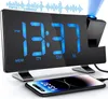 A digital alarm clock with a projected time and a smartphone charging on its base. Produktbild-Vorschau
