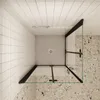A top-down view of a modern shower enclosure with black frames and clear glass panels. Produktbild-Vorschau