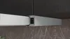 A close-up view of a kitchen range hood with control buttons. Náhled obrázku produktu