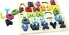 A wooden alphabet puzzle with colorful letters. Voir les images du produit