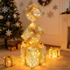 Christmas decorations in a room, including a Christmas tree and a fireplace. Produktbild-Vorschau