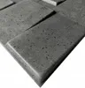 A close-up, angled view of textured gray wall panels with a brick-like pattern. Náhled obrázku produktu