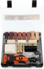 A kit for repairing wood surfaces, containing various colored wax sticks, a heating tool, batteries, and other accessories, all neatly arranged in a black plastic case with a clear lid. Náhled obrázku produktu