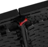 A close-up view of the underside of a black folding table, showing a red locking mechanism. Náhľad obrázku produktu