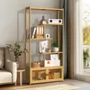 A bamboo bookshelf filled with various items, placed in a room next to a sofa and a window. Produktbild-Vorschau