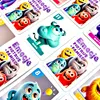 A collection of cards from a board game featuring cartoon monsters with different emotions. Podgląd zdjęcia produktu