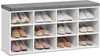 A white shoe rack with a gray upholstered top, filled with various shoes. Produktbild-Vorschau